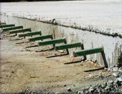 Highway pavement edge with drainage outlets